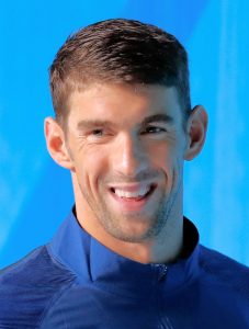 Michael Phelps biography: Explore his age, height, family, swimming career, Olympic medals, achievements, unknown facts, records, and life journey of the greatest swimmer in history.